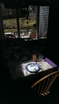 sunlight shines brightly at one end of the table
